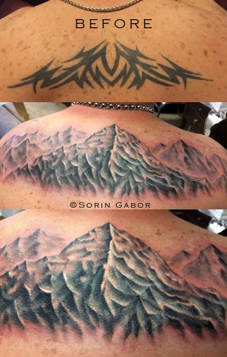 Sorin Gabor - Realistic black and gray mountains over a tribal coverup